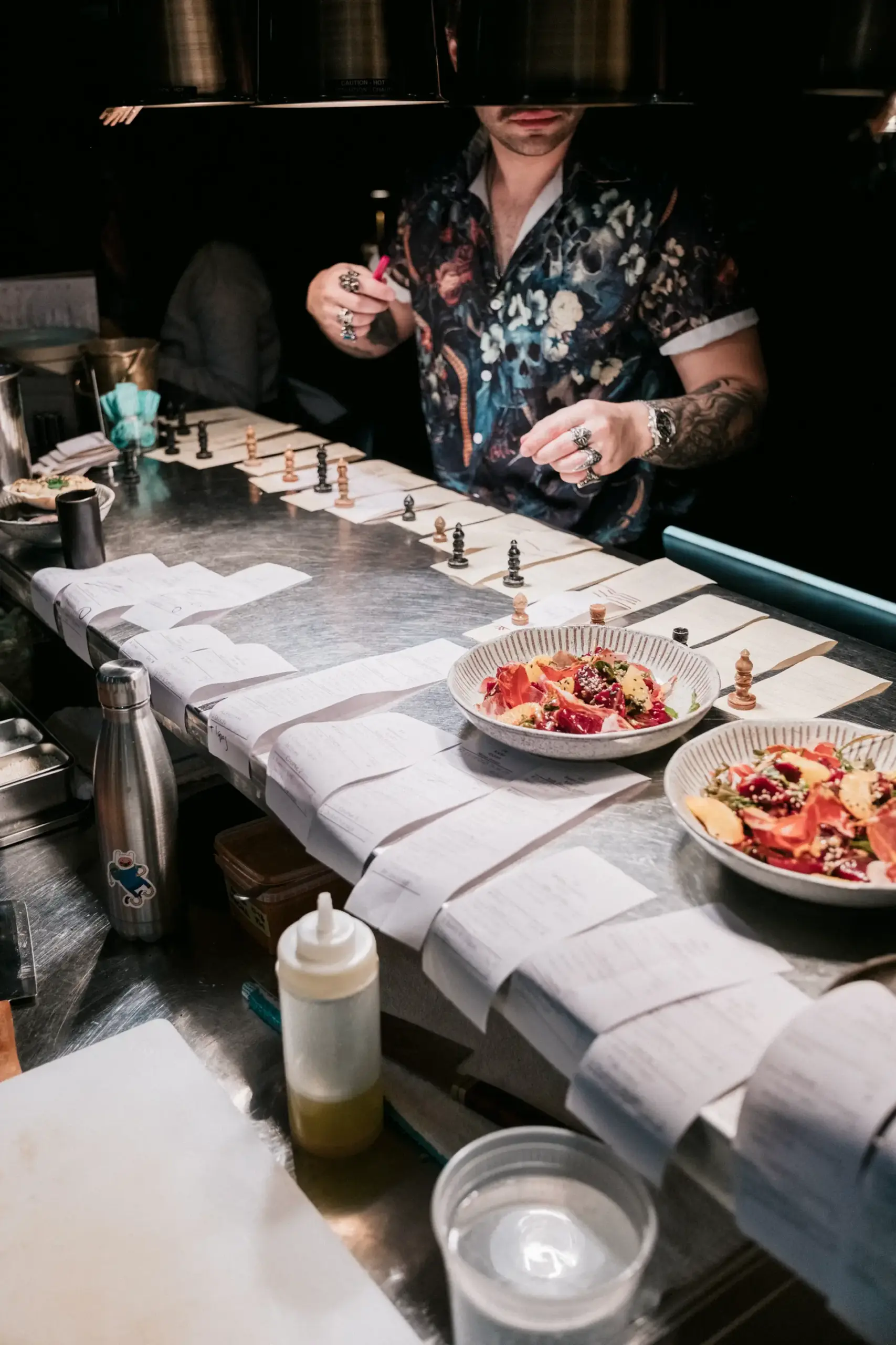 A chef finishing a row of plates at last year’s Chive Cup
